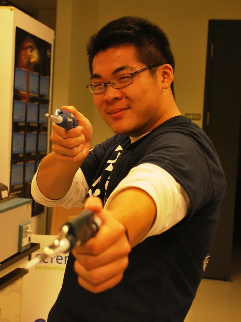 Miming a quick draw with micropipettes in the lab