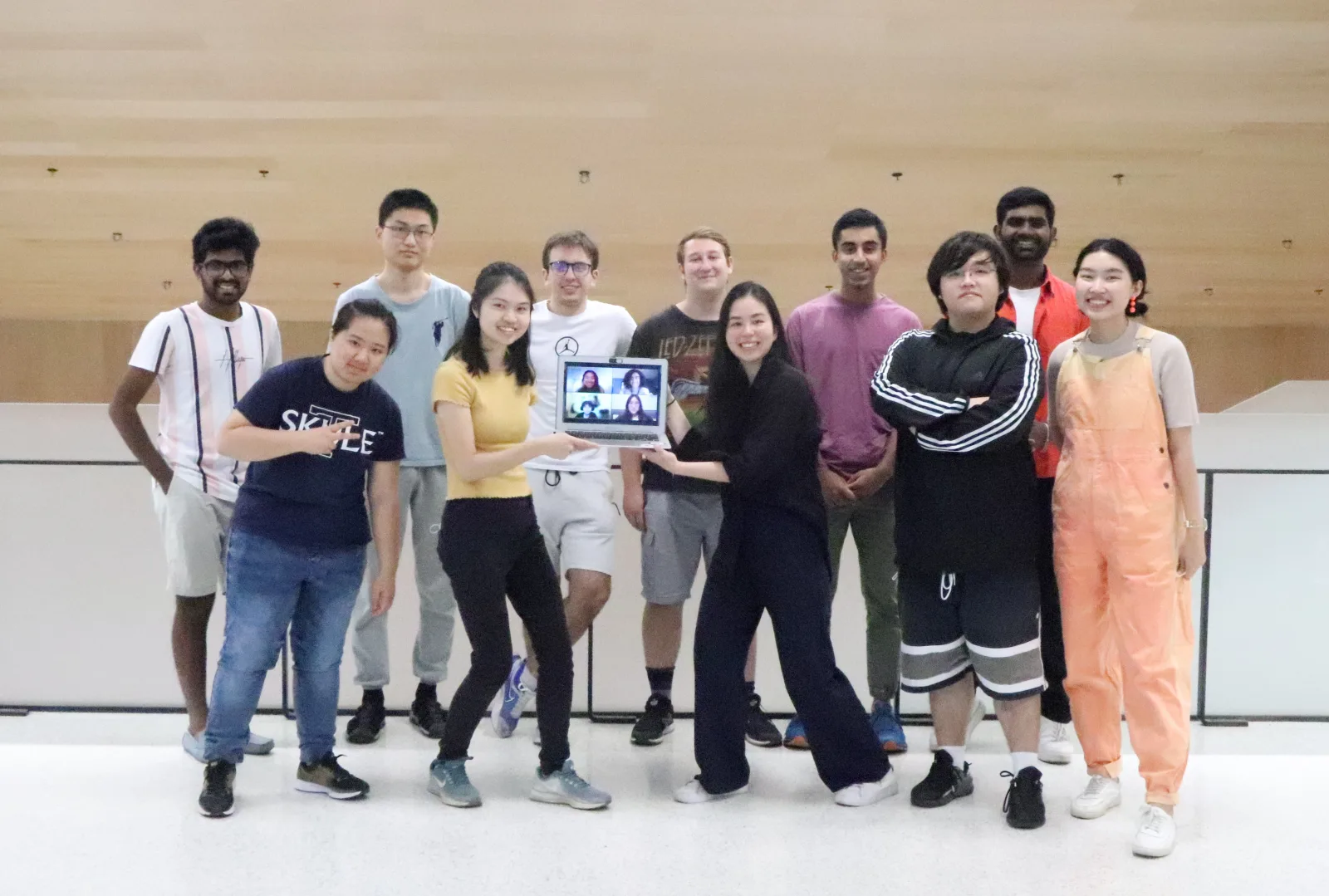 The 2022 team, joined virtually by teammates on a video call