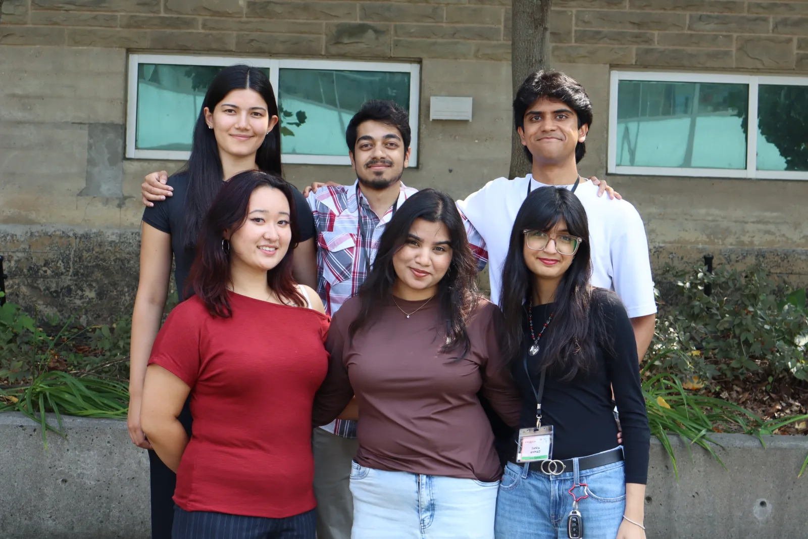 Team group photo outside the Great Canadian Meetup venue, McMaster University, 8–9 August 2026
