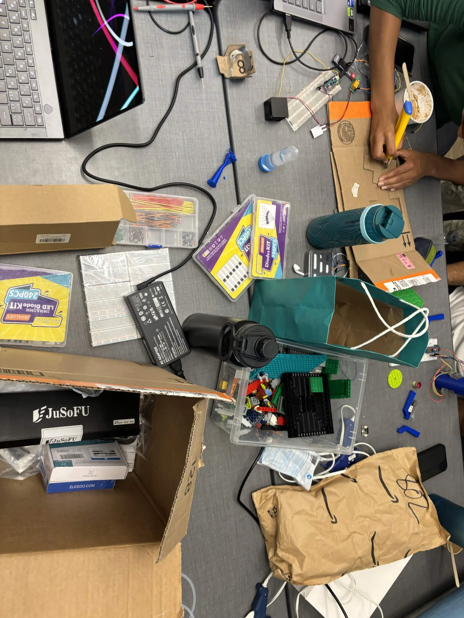 Assembling a cardboard prototype enclosure for the bioreactor housing, late July 2026