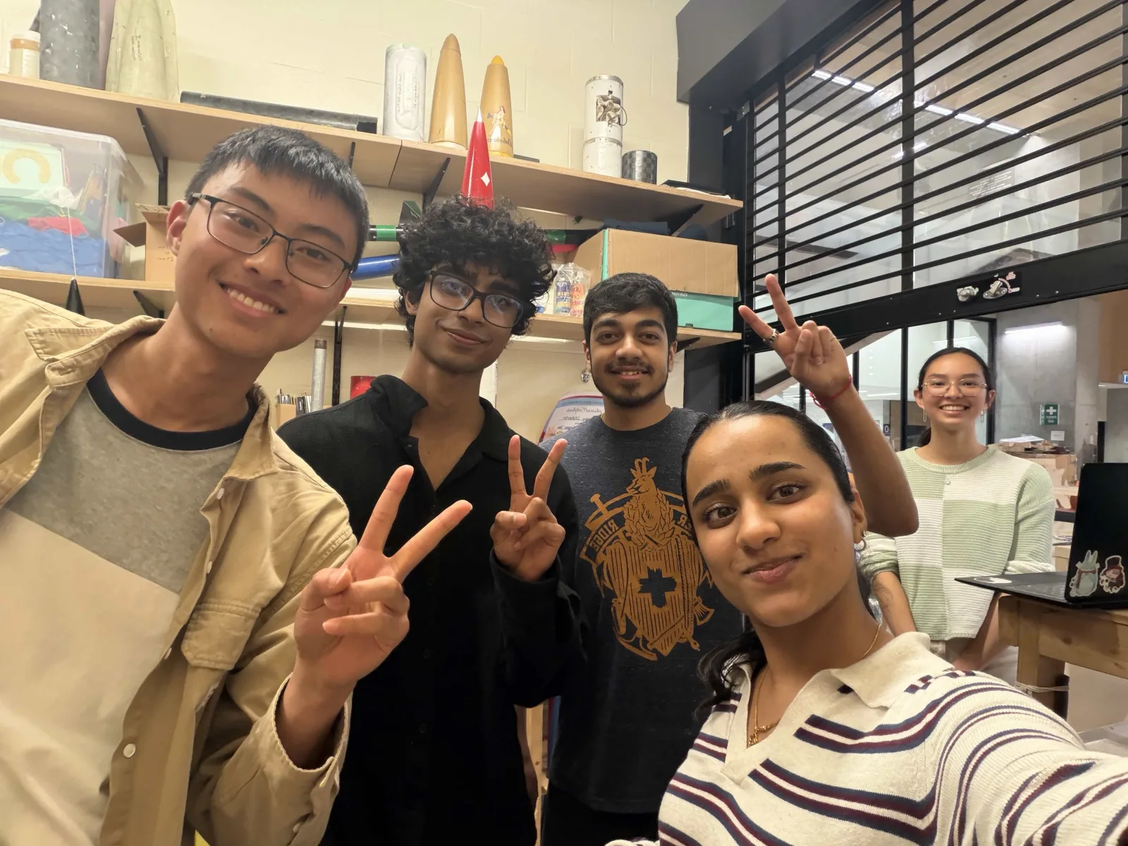 Behind the scenes in the hardware workshop while filming the team's promo video, July 2026