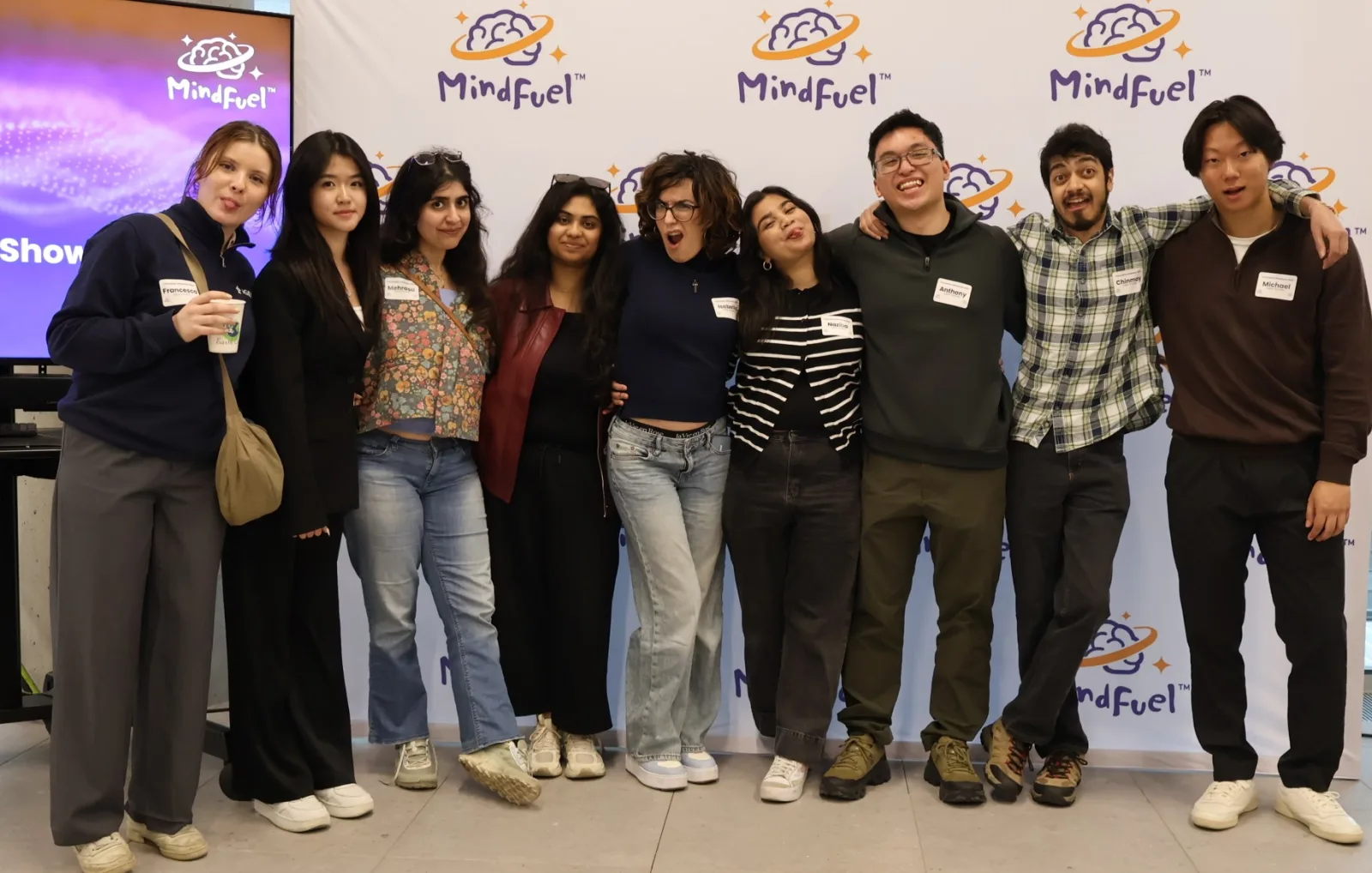 Team poses at the MindFuel step-and-repeat backdrop, Tech Futures Challenge Innovation Showcase, Calgary, 30 May 2026