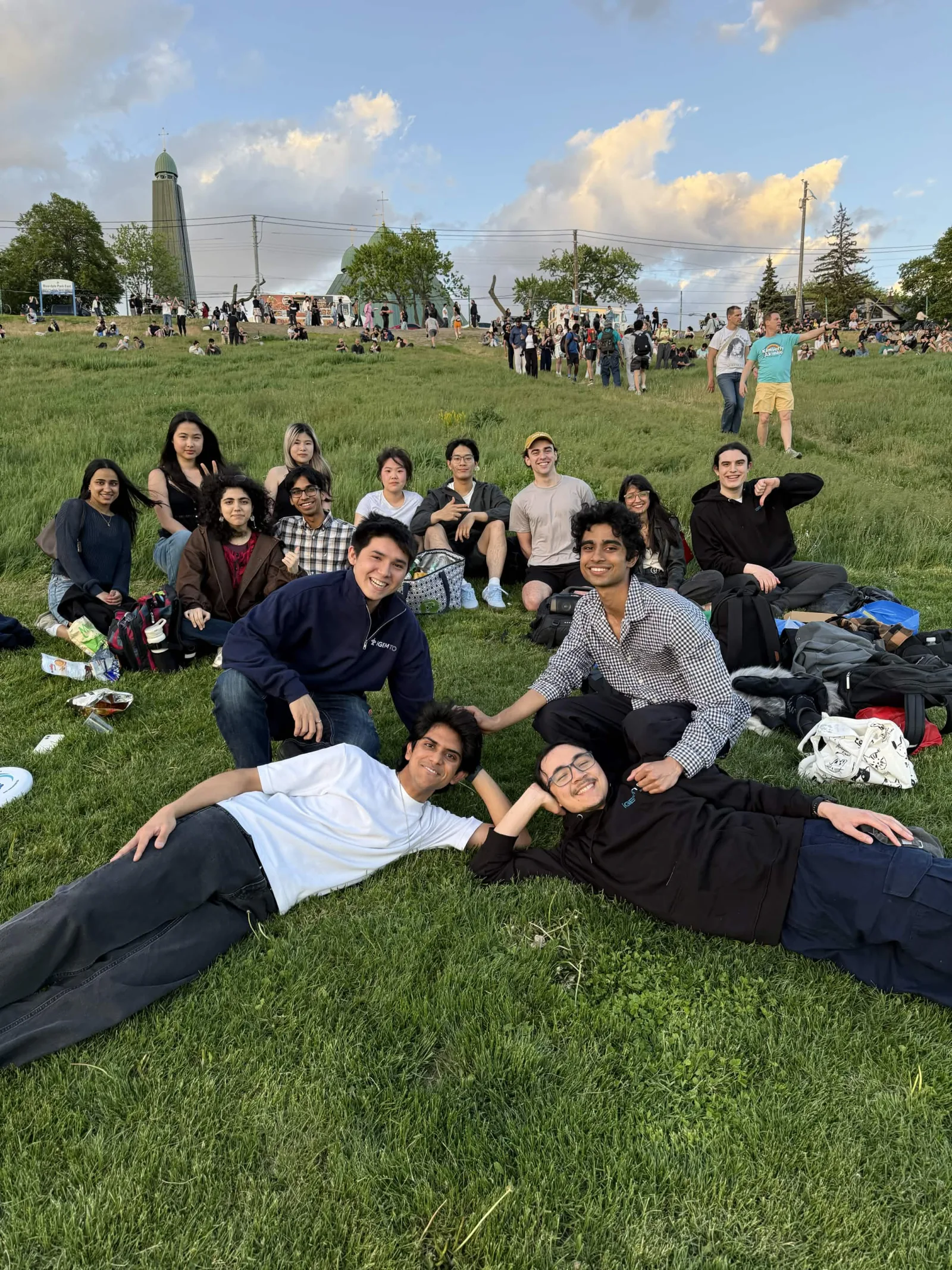 Wide view of the team relaxing together during an evening park outing