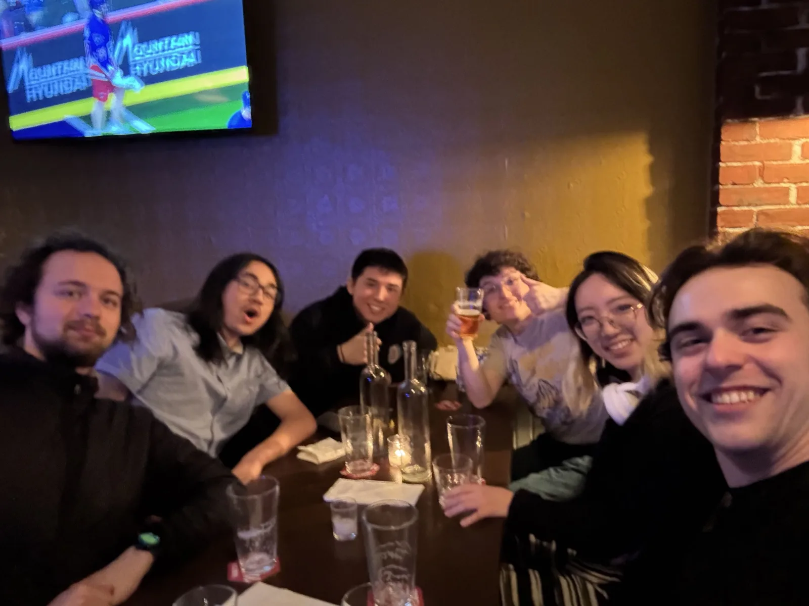 Team gathers for drinks and conversation at a pub, May 2026