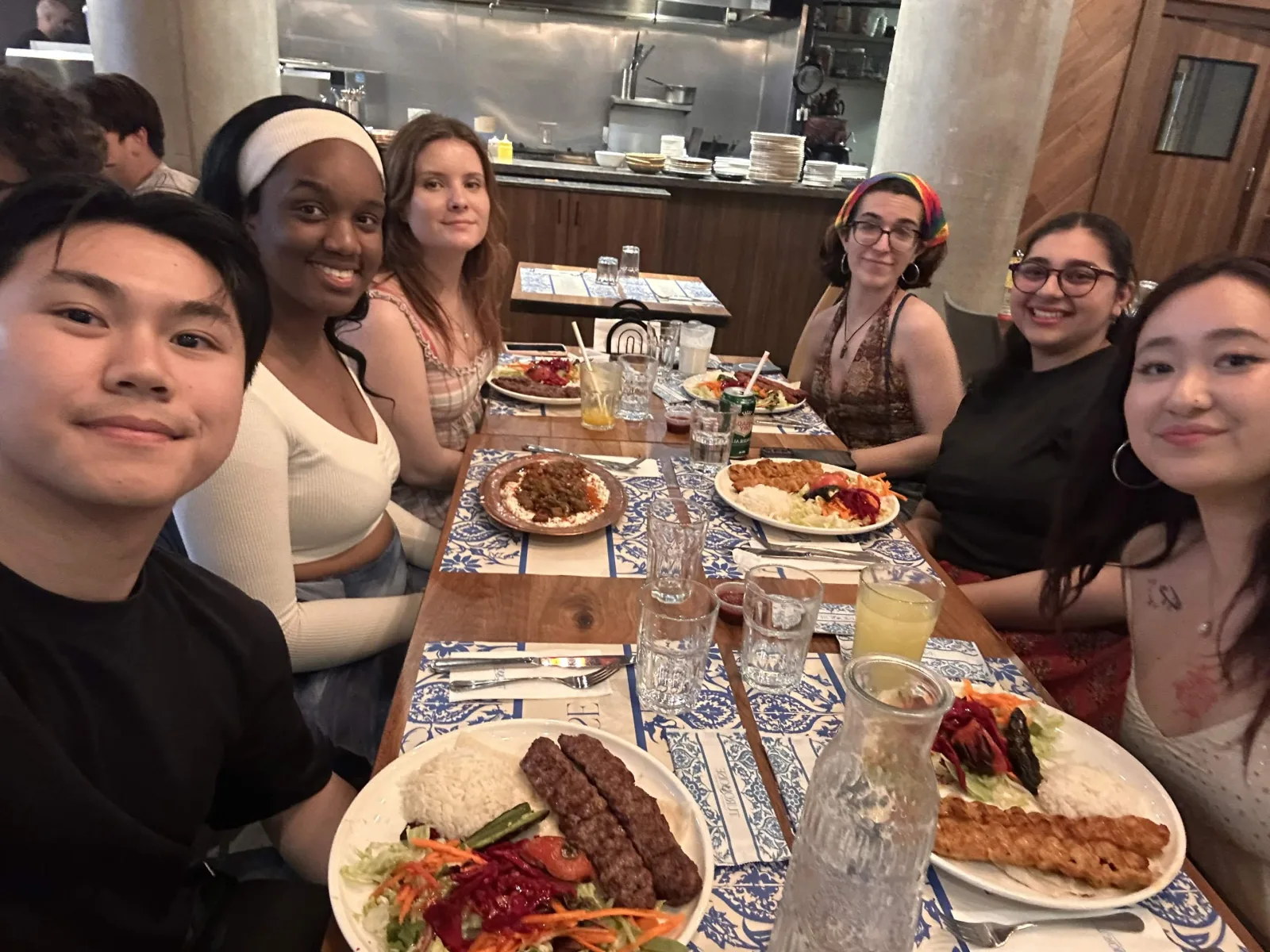 Team dinner at a Middle Eastern restaurant, 05 June 2026 — kebabs and mezze shared around the table.