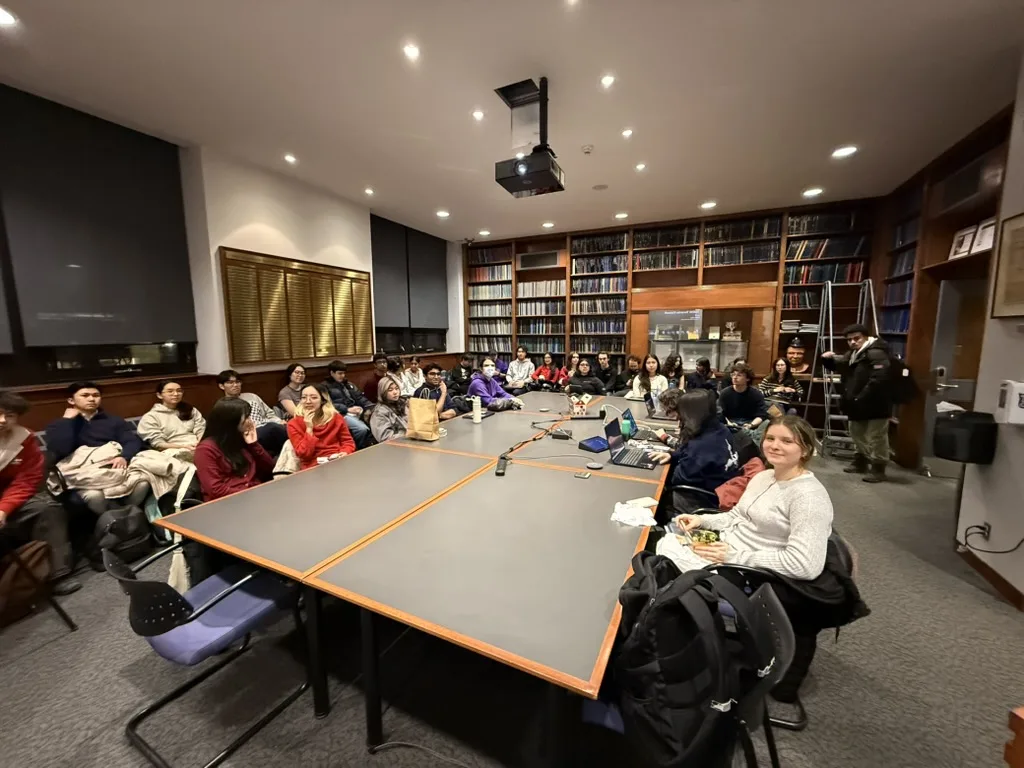 Team meeting in a wood-paneled library room