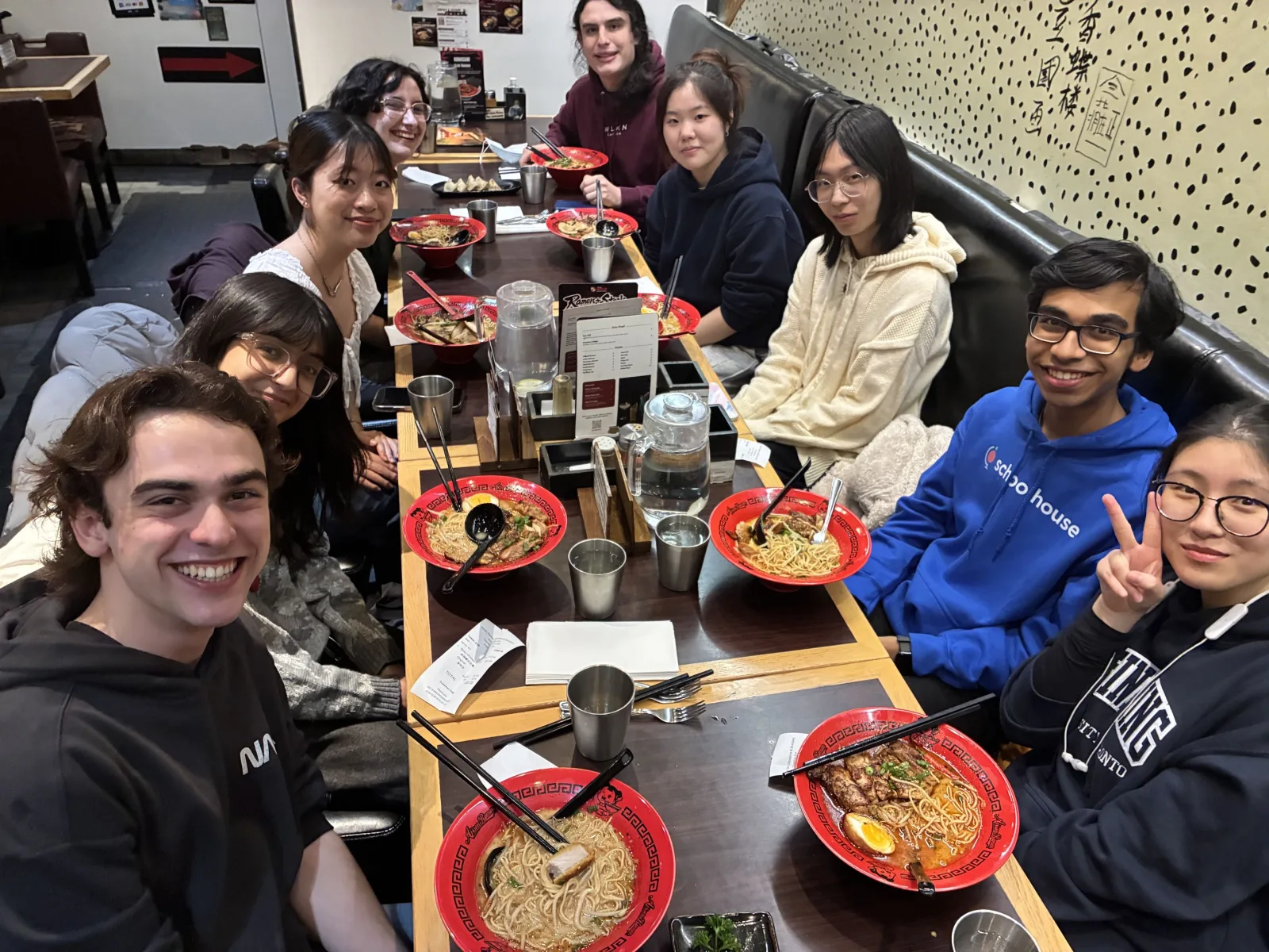 Team celebrates with a big group ramen dinner, March 2026